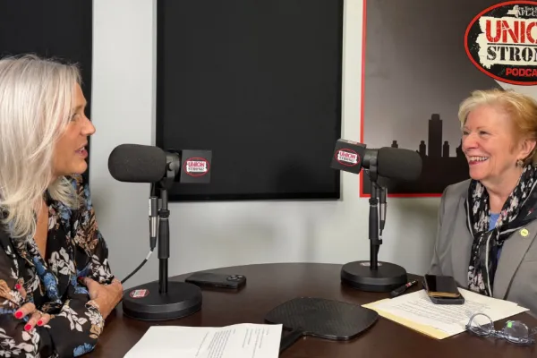darcy wells and roberta reardon talking during interview in podcast studio